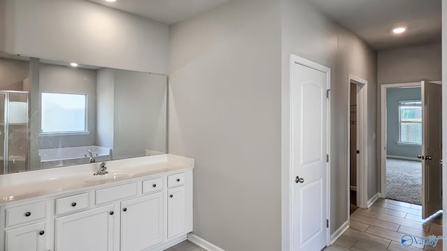 bathroom with separate shower and tub, vanity, and wood-type flooring