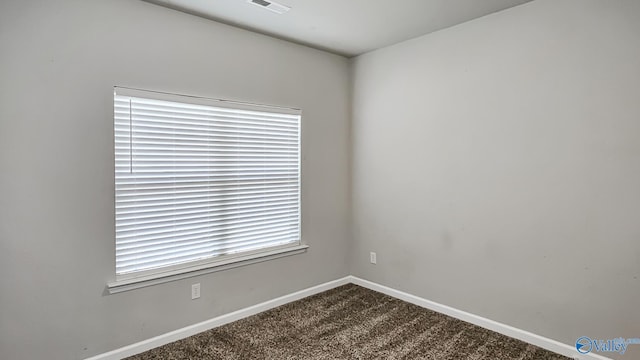 empty room featuring carpet flooring