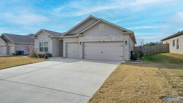 ranch-style house with a garage and a front lawn