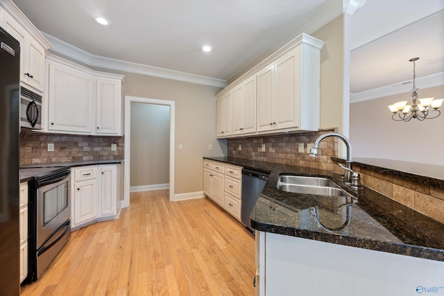 22222 Merlot Dr, Athens, AL 35613 - kitchen featuring stainless steel appliances, a sink, backsplash, and crown molding
