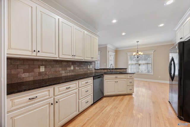 22222 Merlot Dr, Athens, AL 35613 - kitchen featuring a sink, tasteful backsplash, freestanding refrigerator, a chandelier, and dishwashing machine