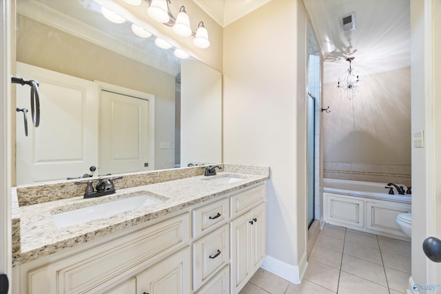22222 Merlot Dr, Athens, AL 35613 - bathroom featuring a bath, double vanity, tile patterned flooring, and a sink