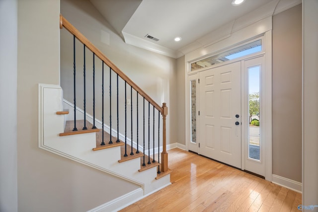 22222 Merlot Dr, Athens, AL 35613 - foyer featuring baseboards, visible vents, stairway, hardwood / wood-style floors, and ornamental molding