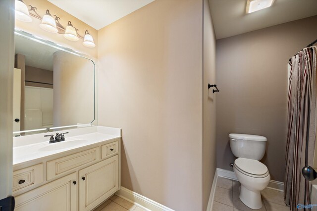 22222 Merlot Dr, Athens, AL 35613 - bathroom featuring vanity, tile patterned flooring, baseboards, and toilet