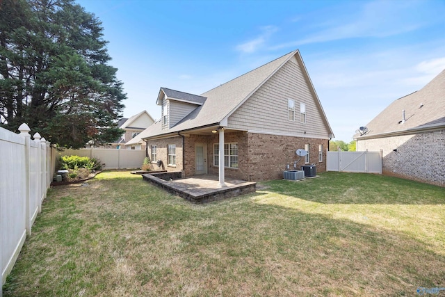 22222 Merlot Dr, Athens, AL 35613 - rear view of house with a fenced backyard, a gate, central air condition unit, brick siding, and a patio