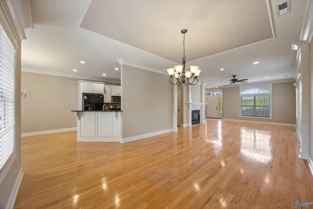 22222 Merlot Dr, Athens, AL 35613 - unfurnished living room featuring light wood-type flooring, recessed lighting, visible vents, and ceiling fan with notable chandelier
