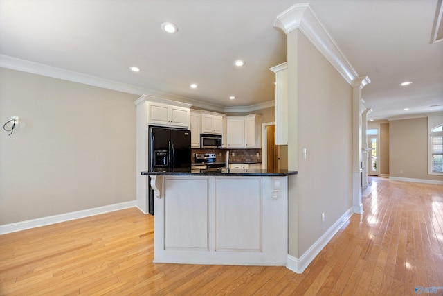 22222 Merlot Dr, Athens, AL 35613 - kitchen featuring light wood-style floors, tasteful backsplash, ornamental molding, and stainless steel appliances