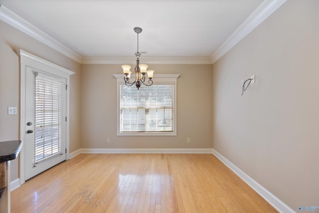 22222 Merlot Dr, Athens, AL 35613 - unfurnished dining area with an inviting chandelier, light wood-style floors, and a wealth of natural light