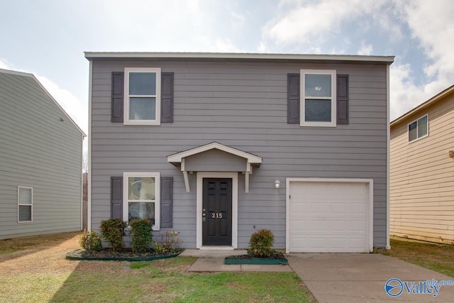 view of front facade featuring a garage and a front lawn