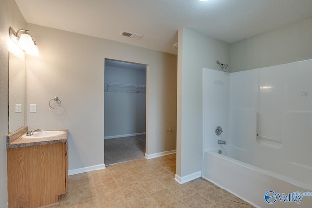 bathroom featuring vanity and shower / bathing tub combination