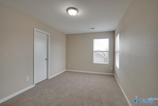 empty room with light carpet