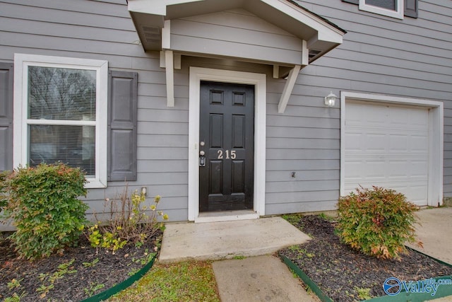 property entrance with a garage