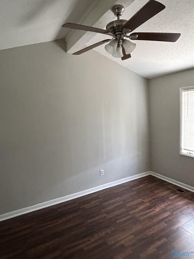 empty room with dark wood finished floors, a textured ceiling, ceiling fan, and baseboards