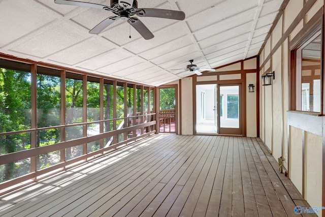 unfurnished sunroom with lofted ceiling, coffered ceiling, and ceiling fan