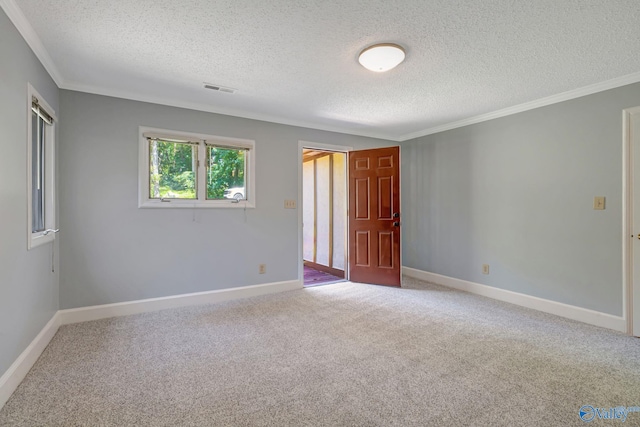 carpeted empty room with baseboards and ornamental molding