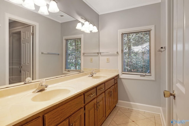 full bath featuring a sink, ornamental molding, double vanity, and tile patterned flooring