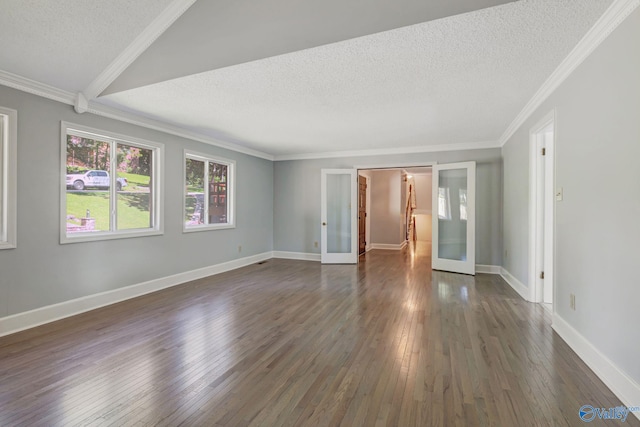 unfurnished room with dark wood finished floors, french doors, baseboards, and a textured ceiling