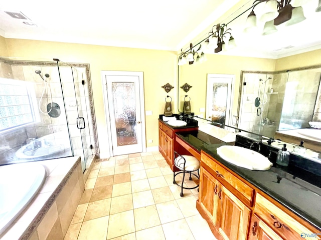 bathroom with independent shower and bath, vanity, and tile patterned flooring