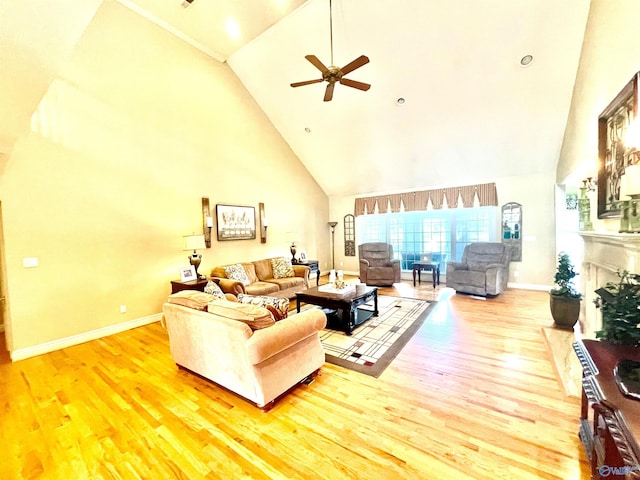 living room with wood-type flooring, ceiling fan, and high vaulted ceiling