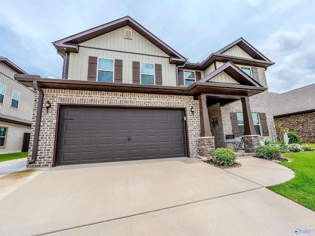 207 Jubilee Cir SE, Huntsville, AL 35803 - view of front of property with brick siding, driveway, board and batten siding, a garage, and a porch