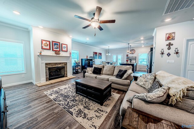 207 Jubilee Cir SE, Huntsville, AL 35803 - living area with a ceiling fan, wood finished floors, ornamental molding, a fireplace, and recessed lighting