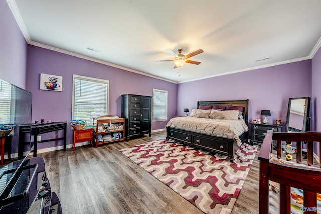207 Jubilee Cir SE, Huntsville, AL 35803 - bedroom featuring wood finished floors, multiple windows, crown molding, and a ceiling fan