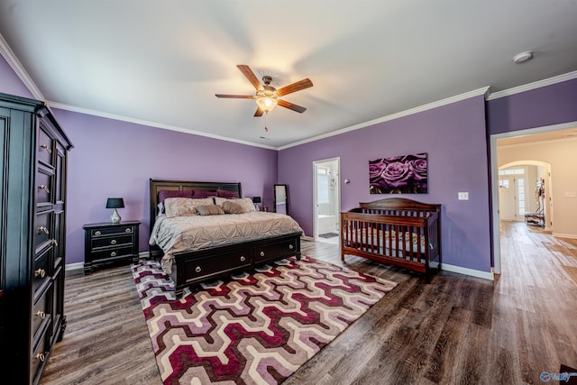 207 Jubilee Cir SE, Huntsville, AL 35803 - bedroom with arched walkways, wood finished floors, ornamental molding, a ceiling fan, and connected bathroom