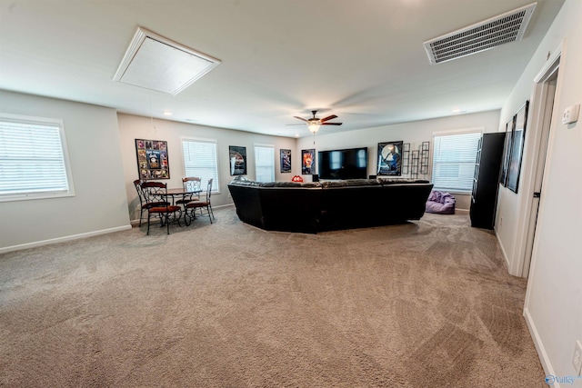 207 Jubilee Cir SE, Huntsville, AL 35803 - living area with attic access, light carpet, healthy amount of natural light, and ceiling fan