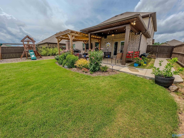 207 Jubilee Cir SE, Huntsville, AL 35803 - rear view of house featuring a playground, a fenced backyard, brick siding, and a pergola