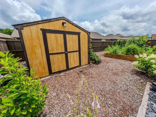 207 Jubilee Cir SE, Huntsville, AL 35803 - view of shed with a garden and a fenced backyard