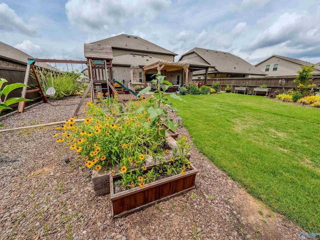 207 Jubilee Cir SE, Huntsville, AL 35803 - fenced backyard with a playground, a garden, and a pergola
