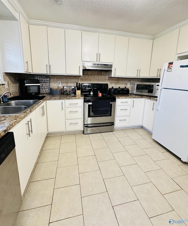 26 Prospect St, Town Creek, AL 35672 - kitchen with under cabinet range hood, appliances with stainless steel finishes, tasteful backsplash, and a sink