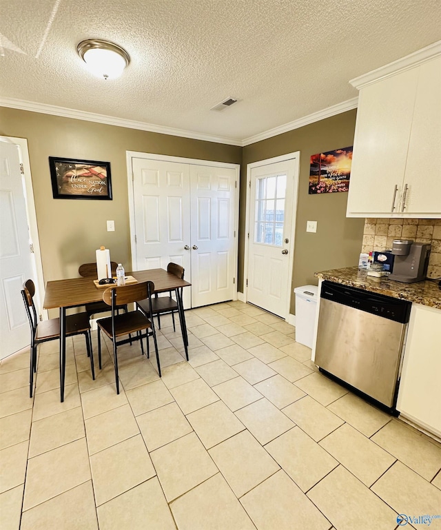 26 Prospect St, Town Creek, AL 35672 - dining room featuring visible vents, a textured ceiling, ornamental molding, and light tile patterned flooring