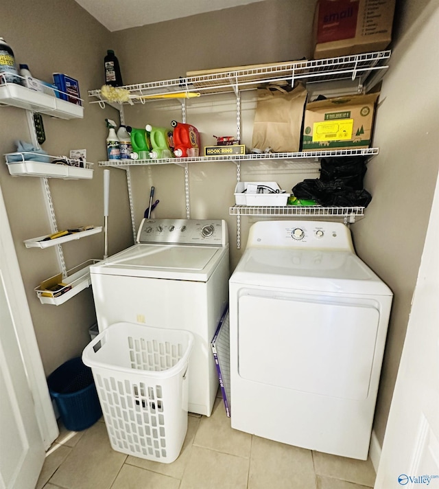 26 Prospect St, Town Creek, AL 35672 - clothes washing area with tile patterned flooring and washer and clothes dryer