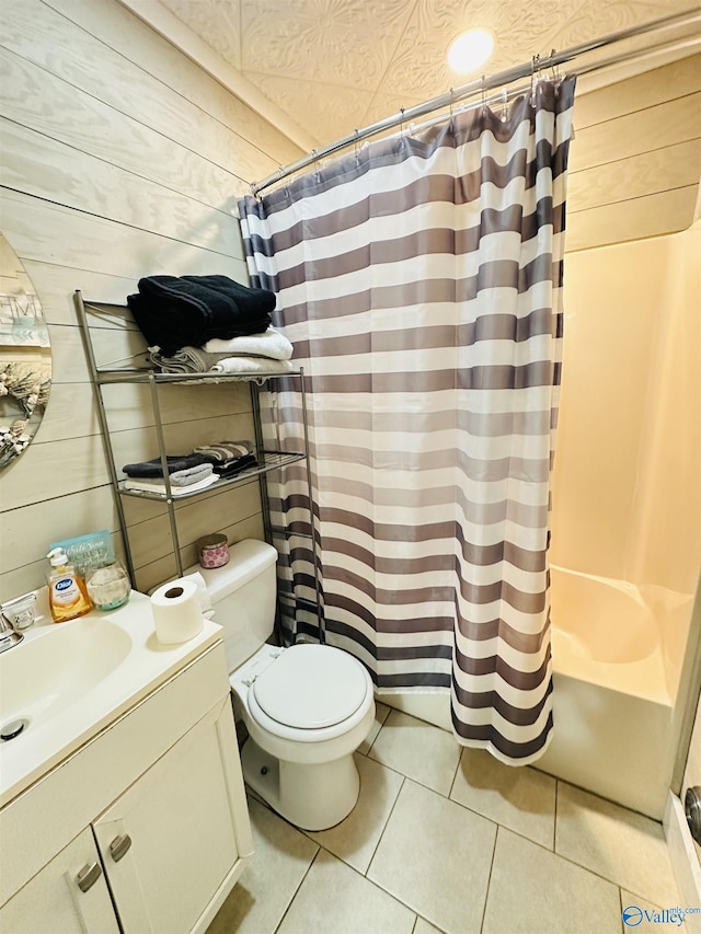 26 Prospect St, Town Creek, AL 35672 - bathroom with shower / bath combo, toilet, tile patterned flooring, wooden walls, and vanity