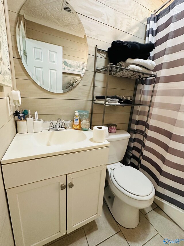 26 Prospect St, Town Creek, AL 35672 - bathroom featuring toilet, wood walls, curtained shower, tile patterned flooring, and vanity