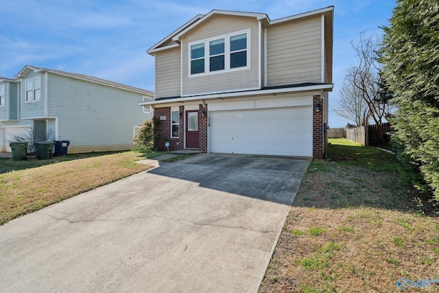 view of front facade featuring a garage and a front yard