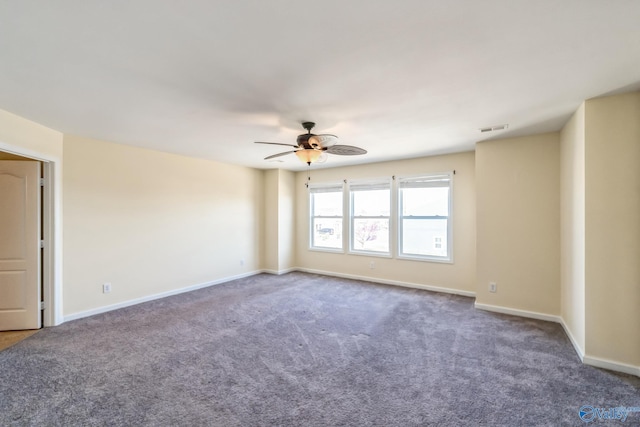 spare room with carpet floors and ceiling fan