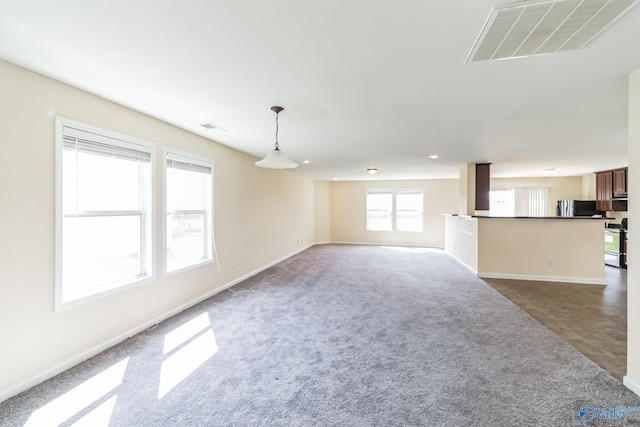 unfurnished living room with carpet