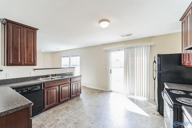 kitchen with range with electric stovetop, black dishwasher, and sink