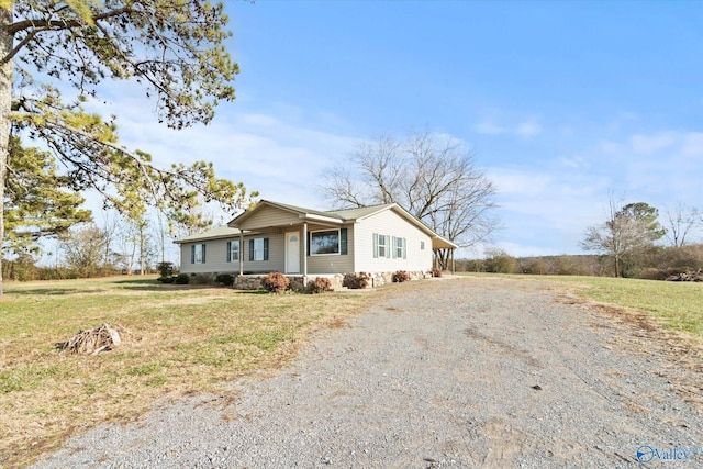 ranch-style home with a front lawn