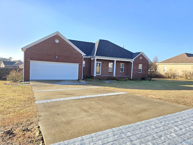 single story home with a garage and a front lawn