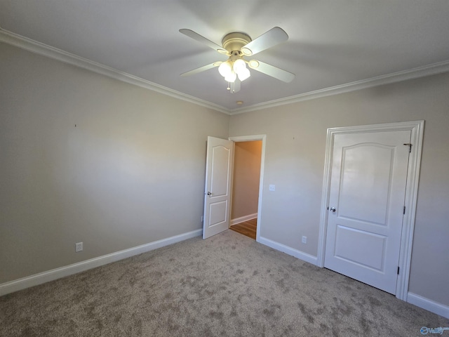 unfurnished bedroom with ornamental molding, light carpet, and ceiling fan