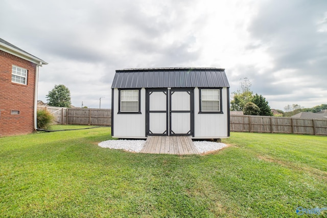 view of outbuilding with a lawn