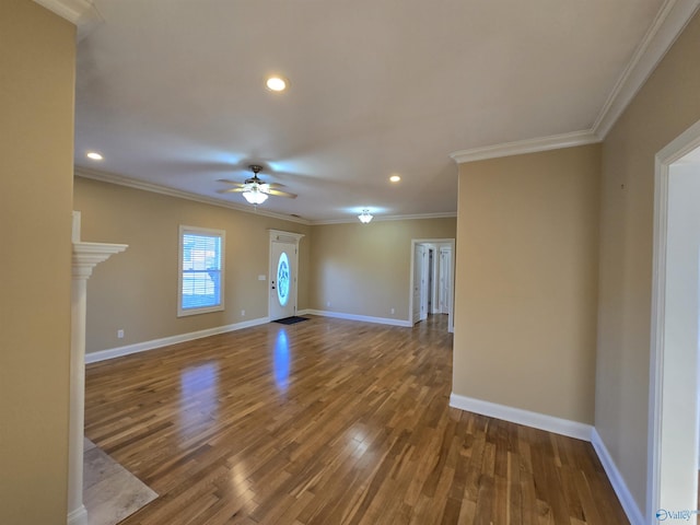 interior space with wood-type flooring, crown molding, and ceiling fan