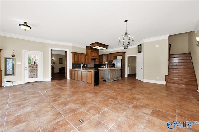 83 James Rd, Hartselle, AL 35640 - kitchen with open floor plan, a chandelier, crown molding, light tile patterned floors, and light countertops