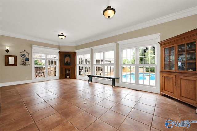 83 James Rd, Hartselle, AL 35640 - unfurnished dining area with light tile patterned floors and ornamental molding