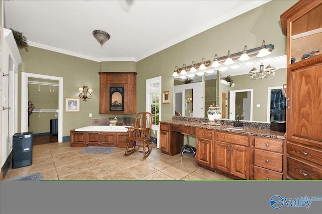 83 James Rd, Hartselle, AL 35640 - bathroom with ornamental molding, a bath, vanity, tile patterned floors, and a chandelier