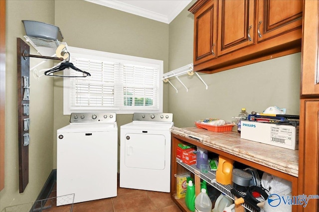 83 James Rd, Hartselle, AL 35640 - laundry room with cabinet space, crown molding, washer and dryer, and dark tile patterned flooring