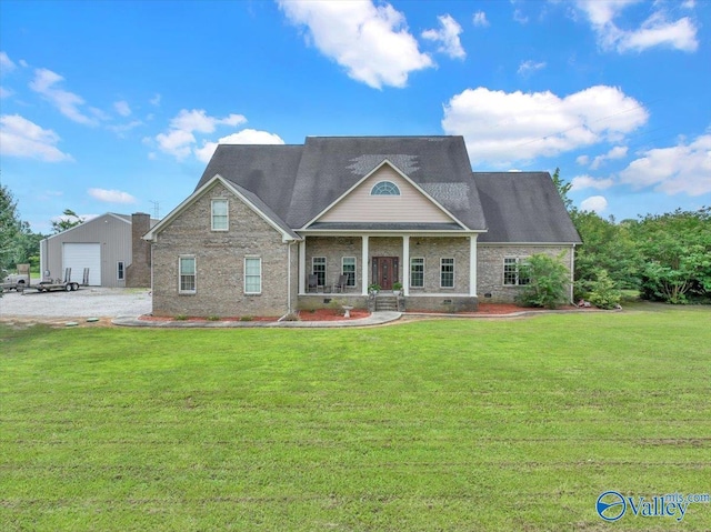 83 James Rd, Hartselle, AL 35640 - neoclassical / greek revival house featuring a front yard, an outbuilding, a detached garage, and brick siding